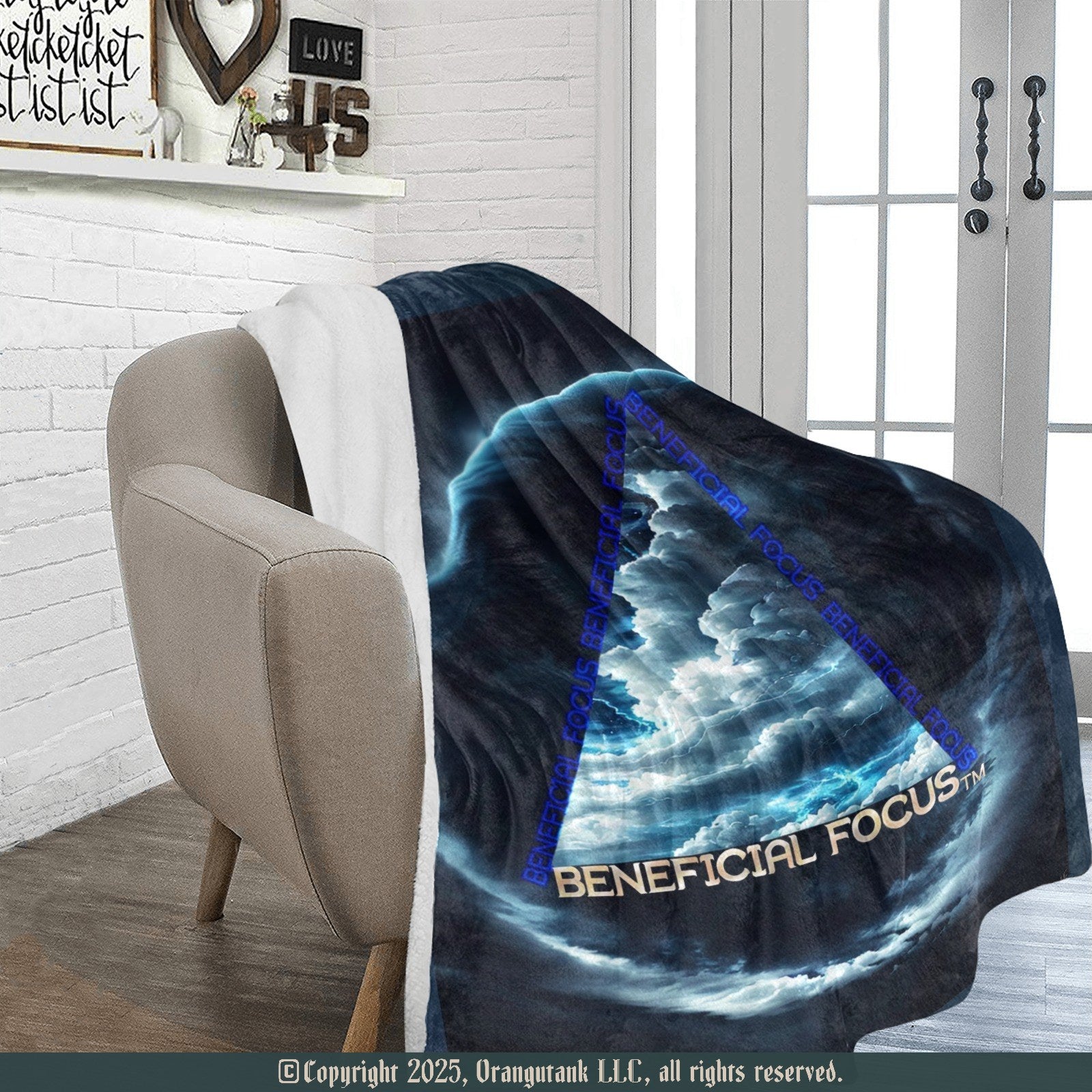 'Beneficial Focus' blanket draped over a chair in a room with a white brick wall and glass door.