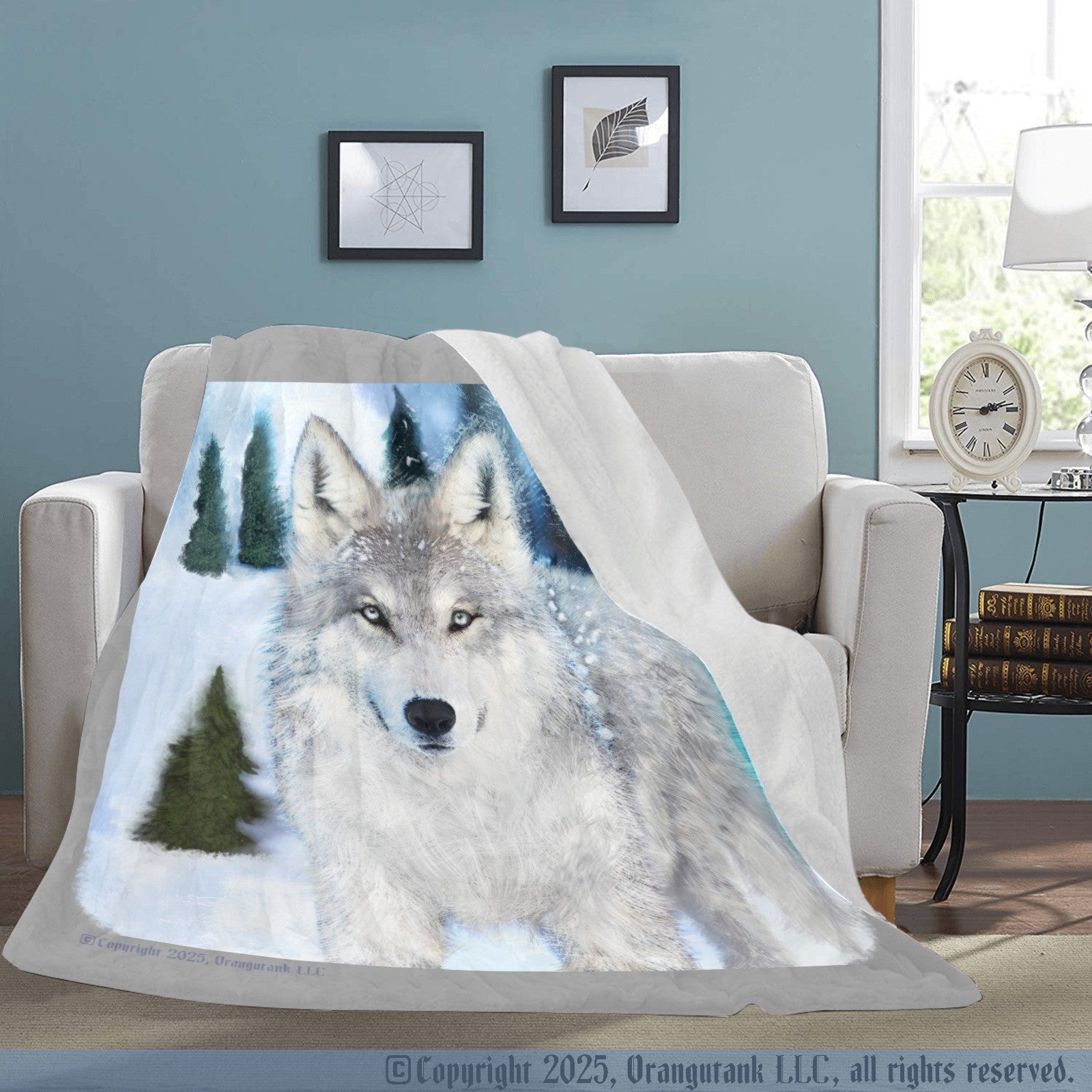 Gray wolf design blanket draped over a chair in a room with a clock and books on a table.